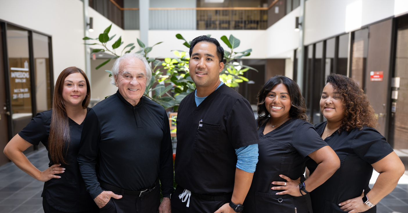 Houston dentists Dr Tran and Dr Frank with dental team