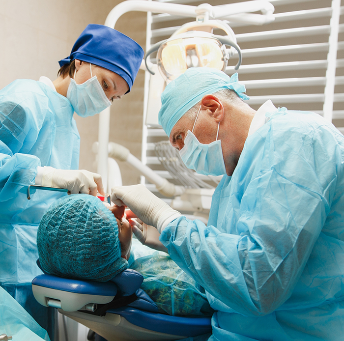 Dentists in Houston performing treatment on patient